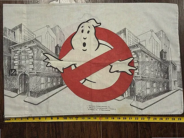 Vintage 1980s Ghostbusters pillowcase "No-Ghost" logo over a black and white